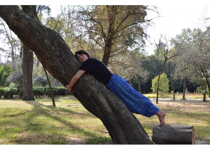 yoga women against tree